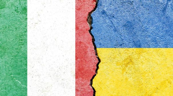 an illustration of the flags of Italy and Ukraine separated by a crack - conflict or comparison - Фото, изображение