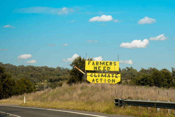 Maanviljelijät tarvitsevat ilmastotoimia - allekirjoittaa tien puolella Australiassa. Viljelijät Ilmastotoimet on liike yli 5000 viljelijät, maatalouden johtajat ja maaseudun australialaiset - Valokuva, kuva