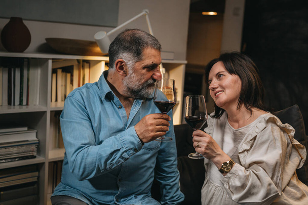 middle age couple drinking wine at home - Photo, image