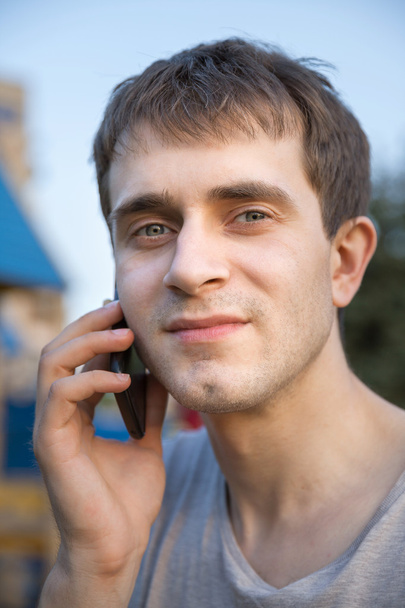 Young man with cell phone - Photo, Image