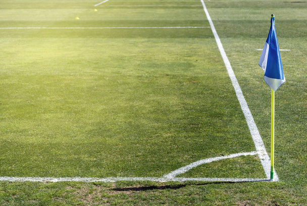Corner flag in a soccer field on a natural grass field. - Fotó, kép