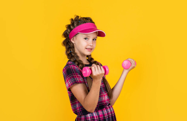 healthy sporty tween girl hold barbells, workout - Photo, Image