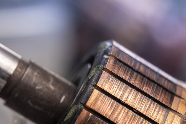 Copper commutator bar of the electric motor close up. Electric motor rotor. - 写真・画像