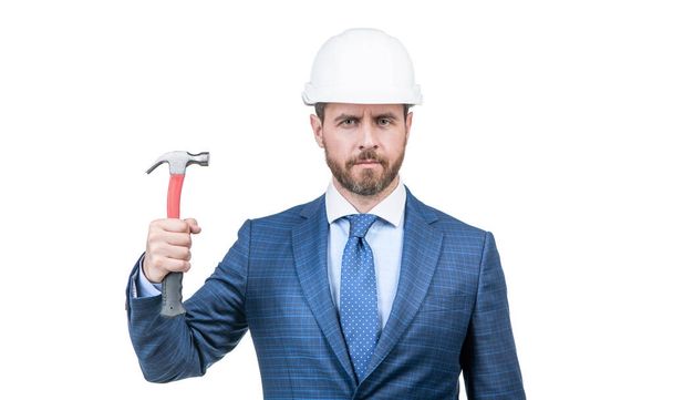 entrepreneur in protective helmet. chief architect engineer. professional engineer in hardhat. confident businessman in suit isolated on white. safety business. successful man hold hammer. - Photo, image