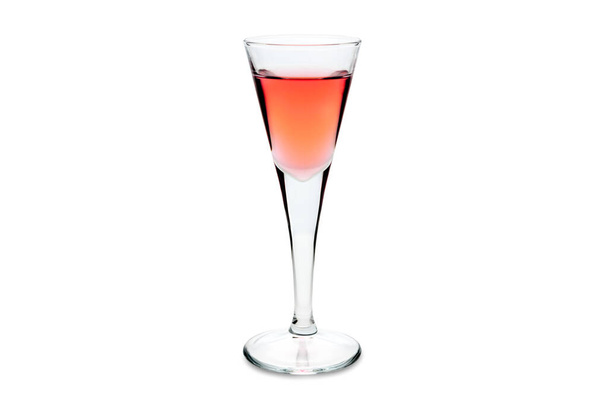Rosolio, typical Italian liqueur distilled from roses in shot glass isolated on white. Copy space - Фото, зображення