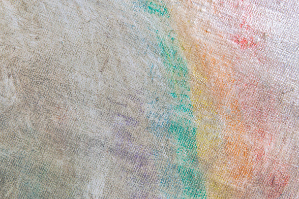 abstract vervaagde veelkleurige achtergrond als gevolg van het afwassen van verf van doek, korte focus. Geen kunstvoorwerp, tijdelijk effect. - Foto, afbeelding