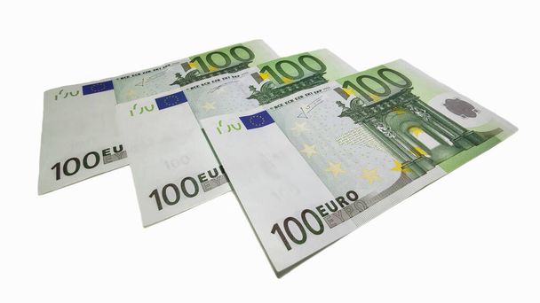 A high angle shot of some Euro banknotes in cash on a white surface - Φωτογραφία, εικόνα