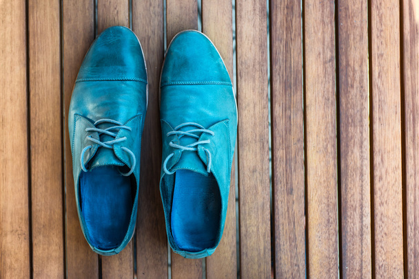 Man shoes on wooden background - 写真・画像