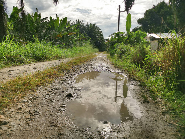 puddle found on the rural road after the heavy shower. - Photo, Image
