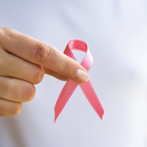 close up person holding awareness ribbon. Resolution and high quality beautiful photo - Fotografie, Obrázek