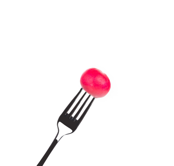 Fresh radish on a fork. - Foto, immagini