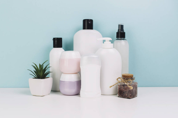 cosmetics jars and bottles near plant. Resolution and high quality beautiful photo - Foto, Bild