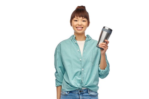 woman with thermo cup or tumbler for hot drinks - Foto, immagini