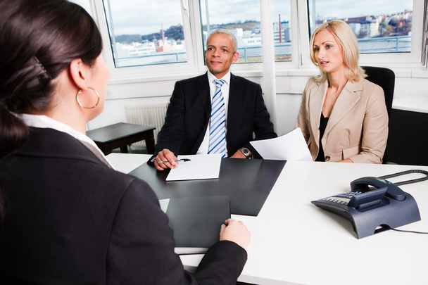 Three businesspeople at an interview in the office - Photo, image