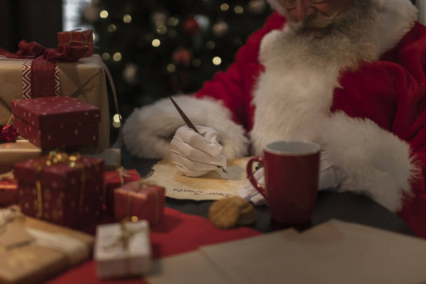 close up santa claus writing letter. Resolution and high quality beautiful photo - Fotoğraf, Görsel