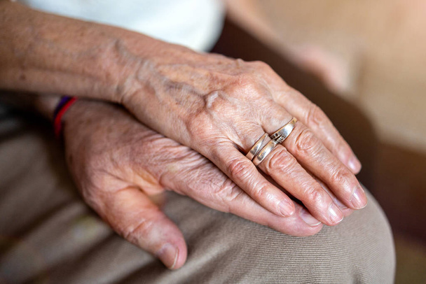 Close up of senior couple holding hands - 写真・画像