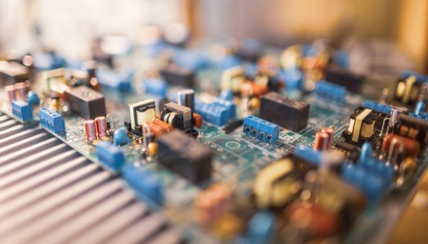 Close-up electric green embedded microcircuits in production - 写真・画像