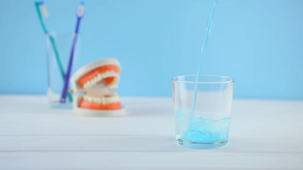 mouthwash on the table in a glass. Oral care - Footage, Video