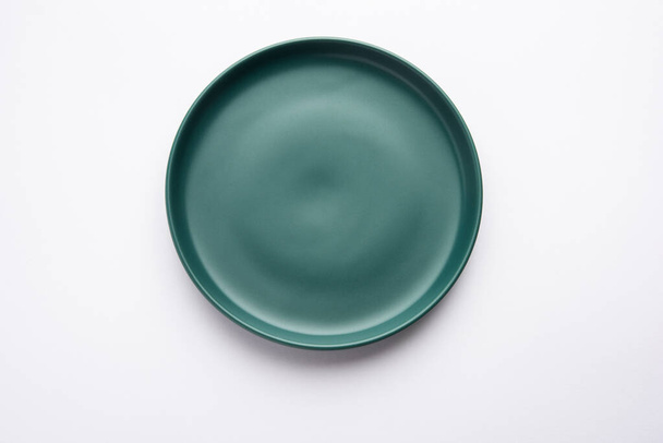 Empty green ceramic rectangular plate isolated on white background - Photo, Image
