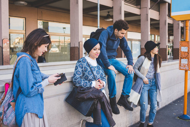 Multiracial group young people at bus stop waiting  - Photo, Image