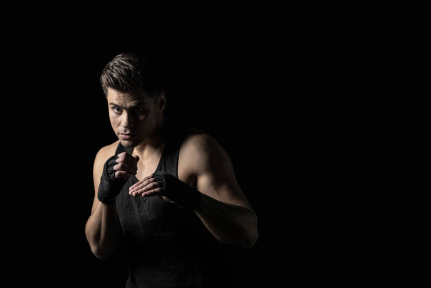 Young man in in boxing stance - Foto, Imagen