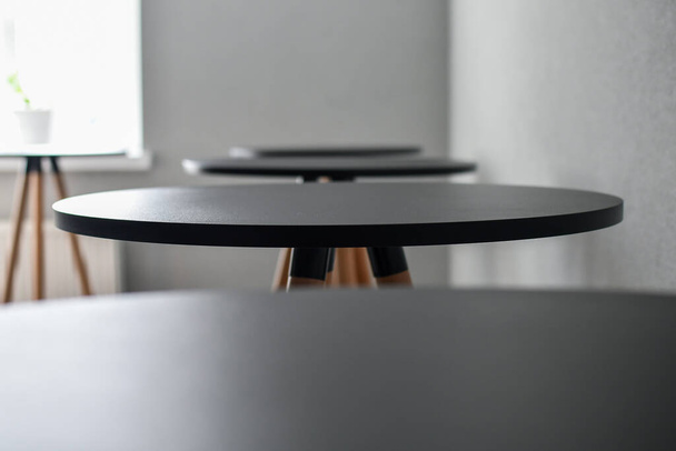 Empty black wooden tables used for catering. Selective focus. - Foto, immagini