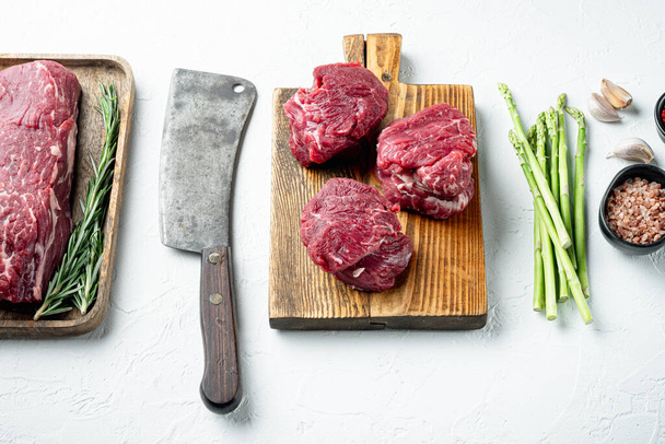 Beef fillet cut raw with ingredients set, on white stone  background - Foto, imagen