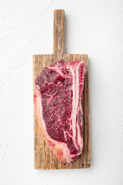 Dry aged club steak set, on white stone  background, top view flat lay - Foto, imagen