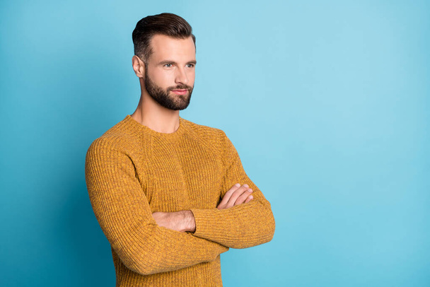Photo of young handsome attractive man smiling with folded arms look copyspace isolated on blue color background - Fotoğraf, Görsel