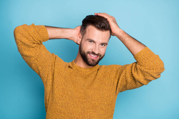Portrait of nice attractive cheerful guy touching clean smooth hair coiffure isolated over bright blue color background - Foto, afbeelding