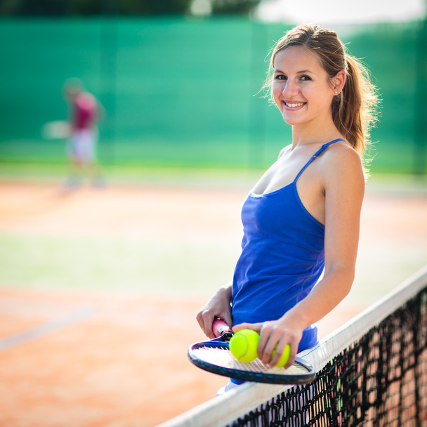 Young tennis player  on  a court - Fotografie, Obrázek