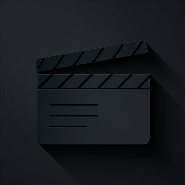 Papier gesneden Film clapper pictogram geïsoleerd op zwarte achtergrond. Filmklapbord. Bord met klepborden. Filmproductie of media-industrie. Papierkunst stijl. Vector - Vector, afbeelding