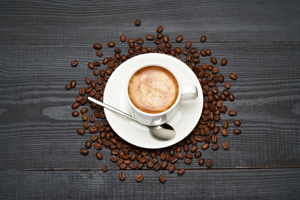 Cup of espresso coffee on dark wooden background - Photo, Image