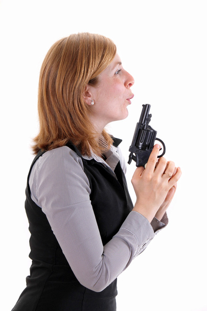 Profile view of woman holding a hadgun - Photo, Image