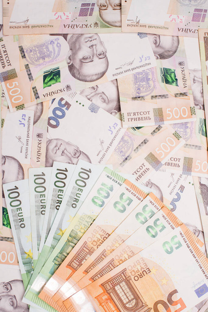Hryvnia ucraniana, dólar americano, moeda do euro, notas novas. Close-up. Contexto financeiro. Fundo monetário. - Foto, Imagem