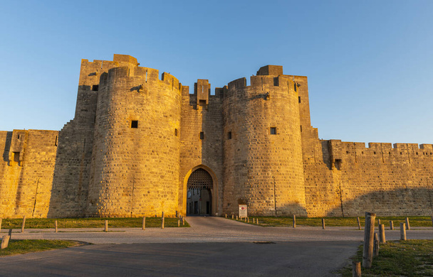 Gate and east ramparts, Aigues-Mortes in the early morning, in the Gard in Occitanie, France - Photo, Image