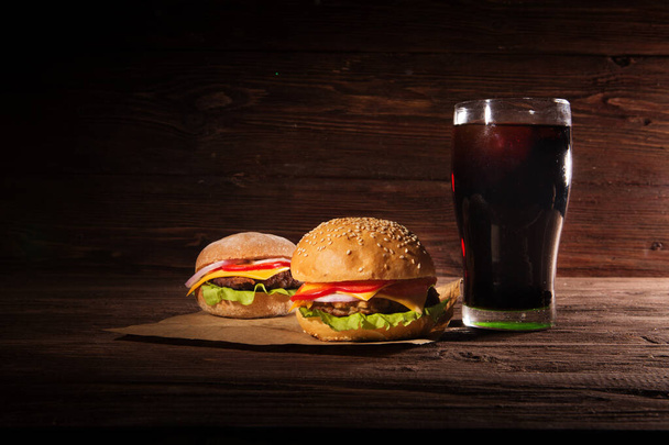 Homemade burger and Cold drink cola on wooden background - 写真・画像
