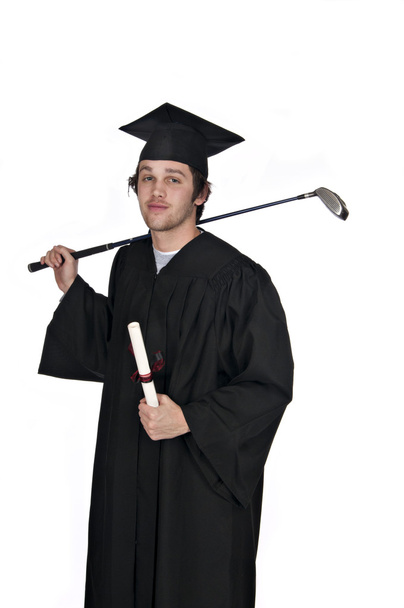 Teenager in black gown holding diploma and golf club - Fotó, kép