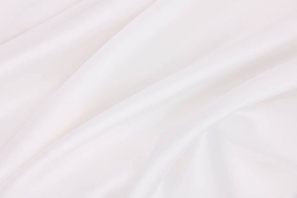 Smooth elegant white silk or satin luxury cloth texture can use as wedding background. Luxurious background design - Фото, изображение