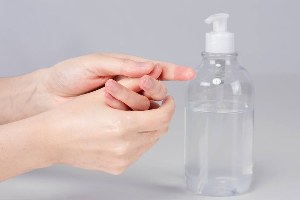 using hand sanitizer, disinfect hands - Фото, зображення