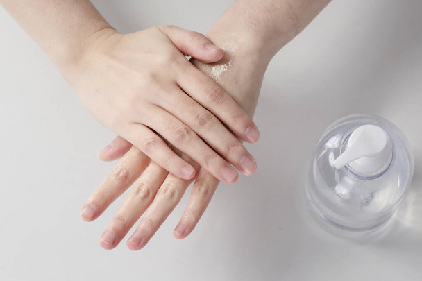 using hand sanitizer, disinfect hands - Fotó, kép