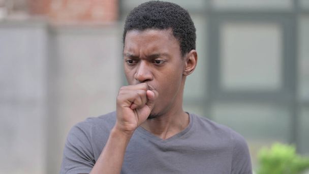 Portrait of Sick Young Young African Man Coughing - Foto, Imagen