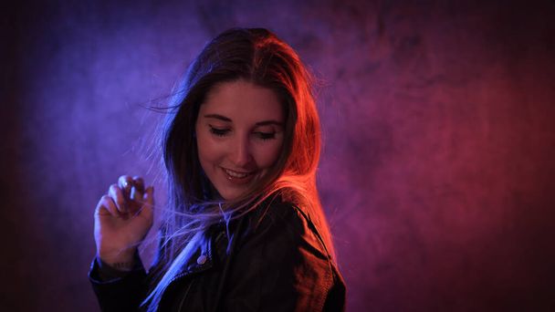 Strong colorful portrait shot of a young woman - Foto, Imagen