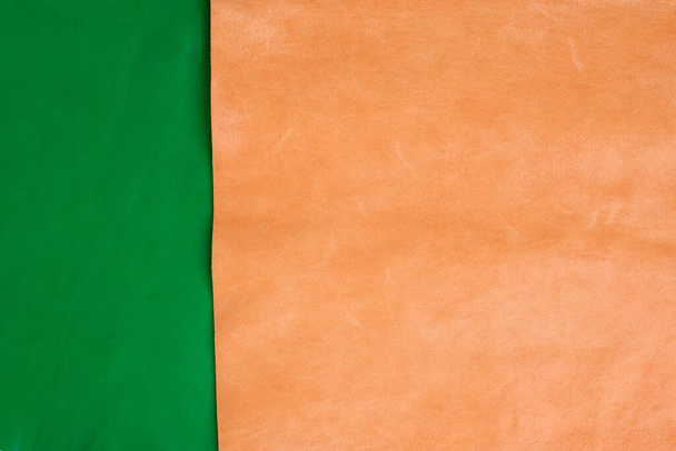 Background texture of leather in green and orange colors - Foto, Imagem