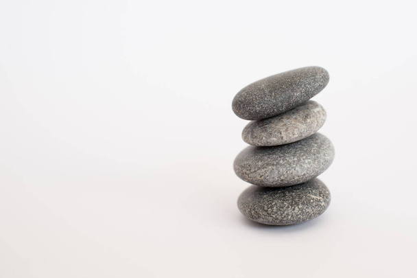 Pile of four stones with white background - Foto, immagini