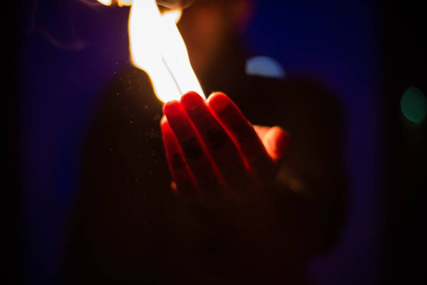 hand on fire, photo at night - Photo, Image