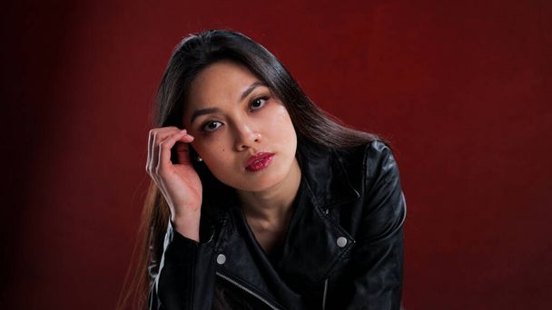 Sexy Asian woman poses in the studio for the camera - Fotografie, Obrázek
