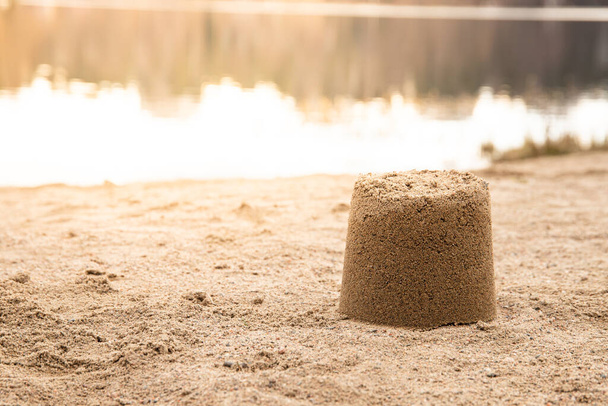 A selective focus shot of a sandcastle on the beach - Photo, image