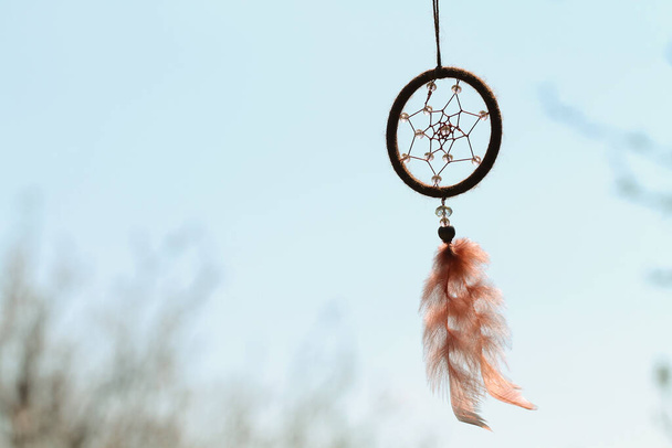 Dreamcatcher with crystal beads on the sky background. Mascot. - Foto, afbeelding