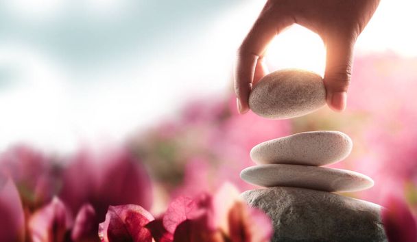 Life Balance Concept. Balancing Mind, Soul and Spirit. Mental Meditation Practice. Hand Setting White Natural Stone Stack - Fotó, kép